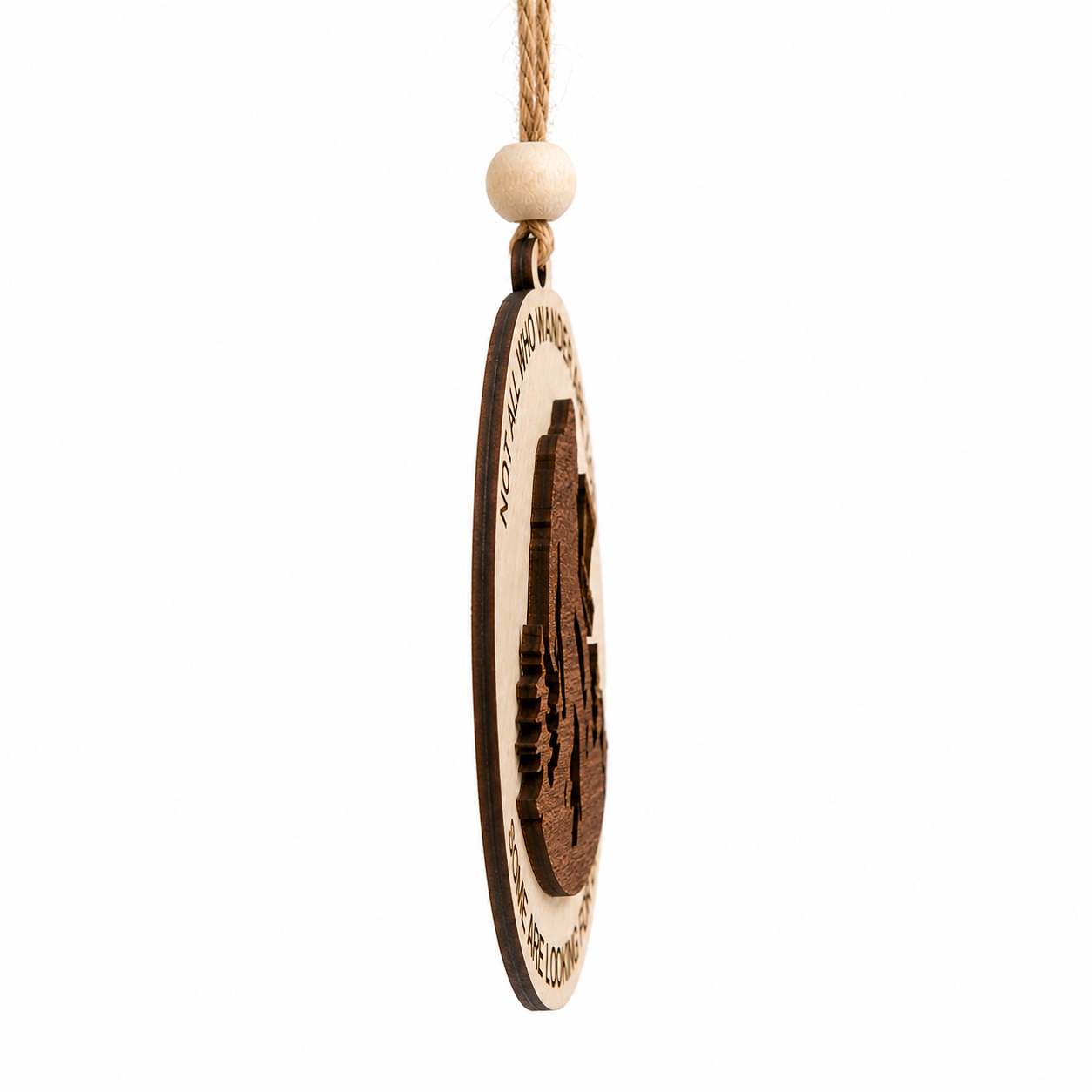 Side profile of a layered laser-cut wood ornament showing the dimensional construction and thickness.