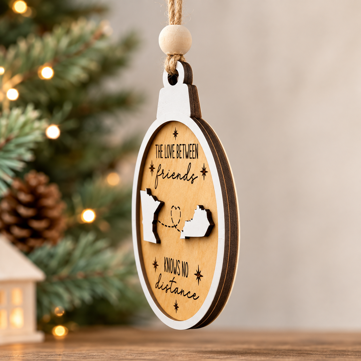 Side profile of a layered wood Christmas ornament showing the dimensional 3D construction, raised state pieces, and premium craftsmanship.