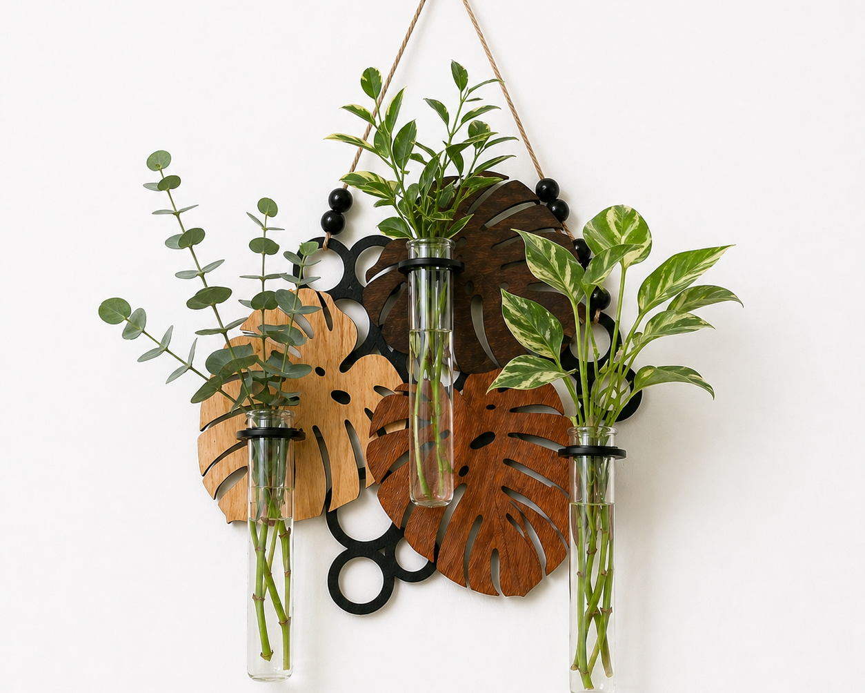 close up of glass tube propagation station with rooted plant cuttings