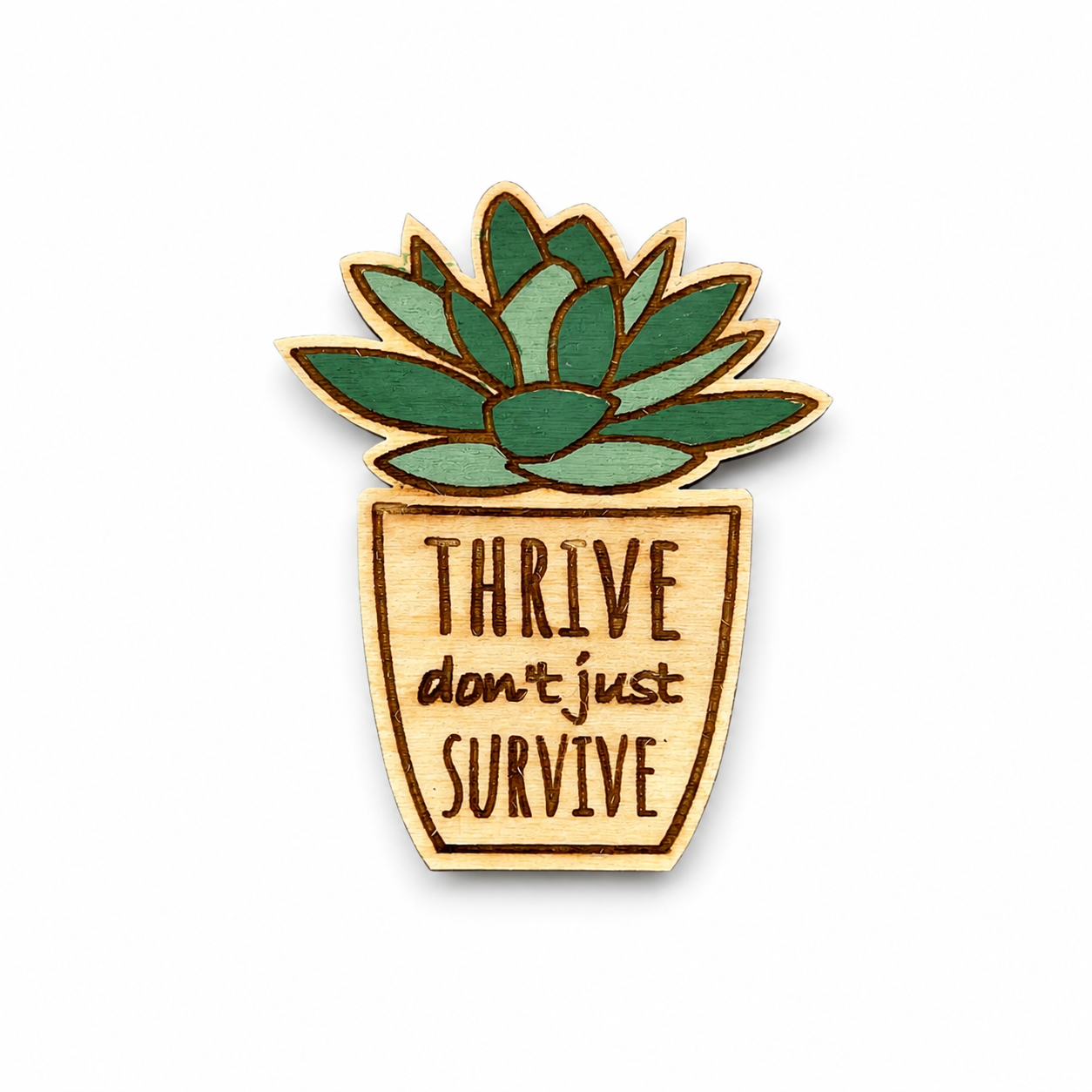 Wooden succulent magnet engraved with Thrive Don't Just Survive on a white background.