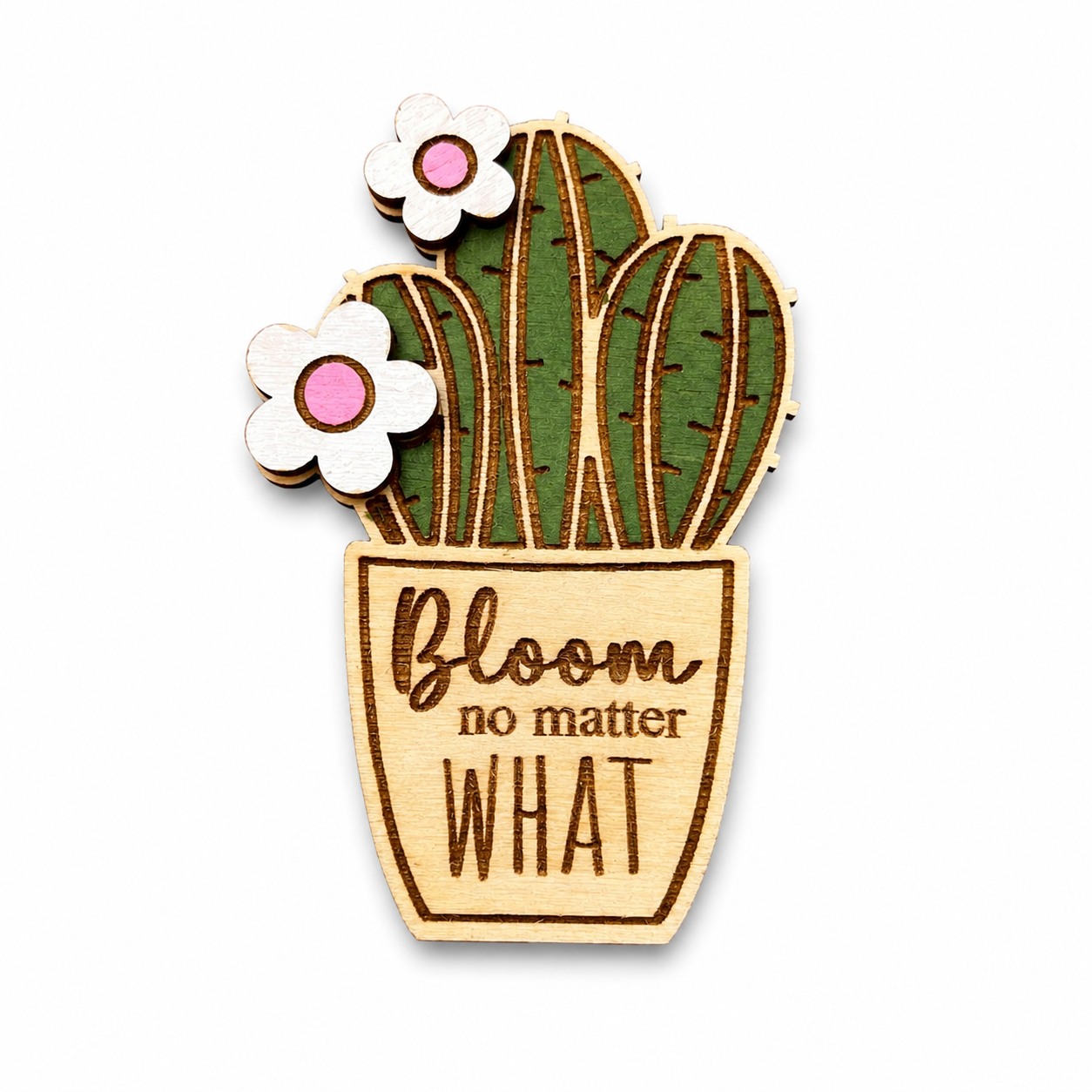 Wooden cactus magnet featuring Bloom No Matter What engraved on natural wood.