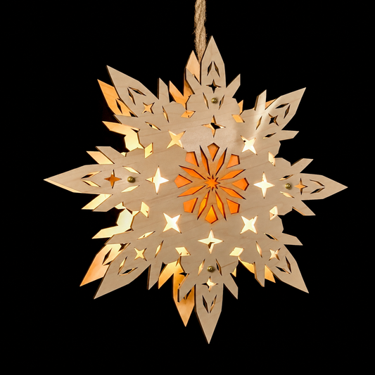Front view of illuminated natural maple wooden snowflake star with intricate geometric cutouts and glowing orange center.