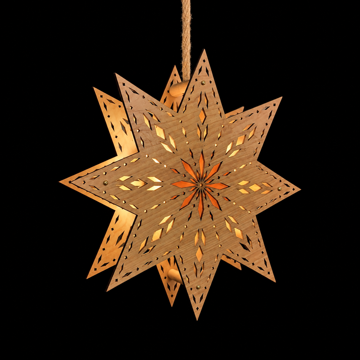 Angled view of an illuminated wooden Scandinavian Welcome Light showing the dimensional front and back layers and warm glowing starburst center.