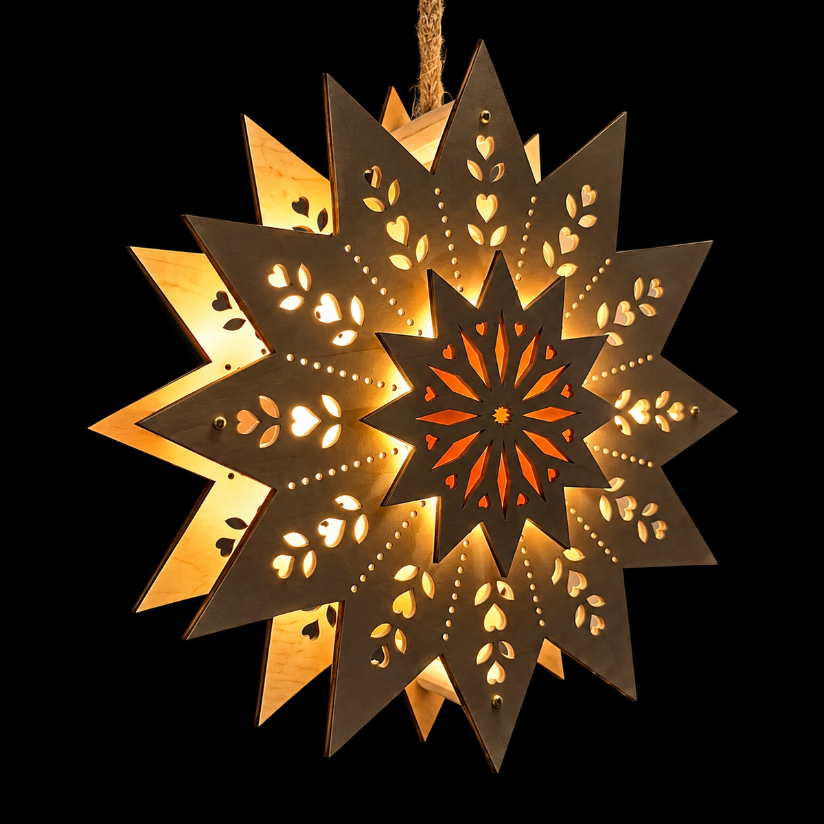 Angled illuminated wood Scandinavian Welcome Light displaying its dimensional star layers, heart and leaf cutouts, and warm golden lighting.